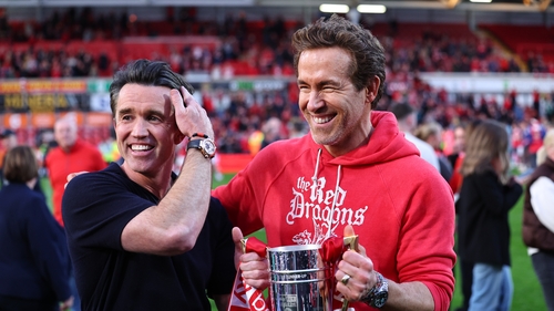 Rob McElhenney and Ryan Reynolds co-owners of Wrexham with the promotion trophy