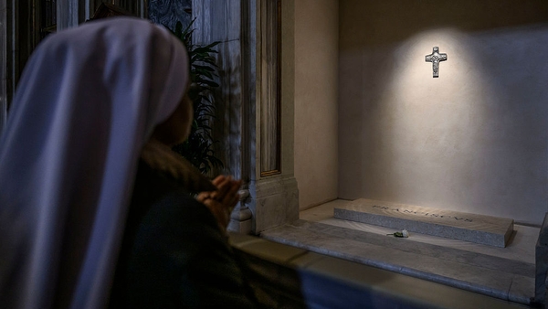 A nun prays in front of the tomb of Pope Francis on the first day of its opening to the public in Santa Maria Maggiore Basilica