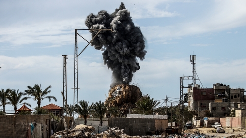 Smoke rises after an Israeli airstrike hit an area in Deir al Balah, central Gaza