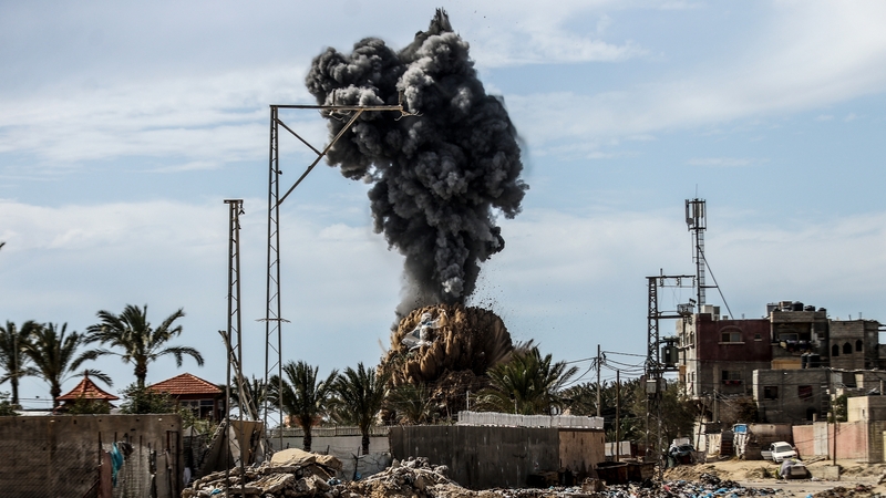 Smoke rises after an Israeli airstrike hit an area in Deir al Balah, central Gaza