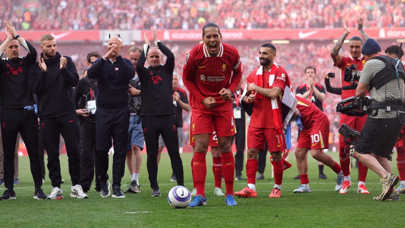 Liverpool captain Virgil van Dijk and his colleagues celebrate in front of the Kop