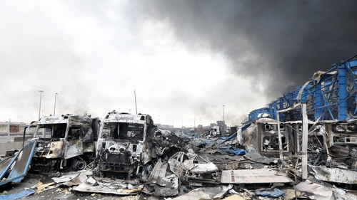 Heavy smoke rises at the scene of an explosion at the Shahid Rajaee port dock