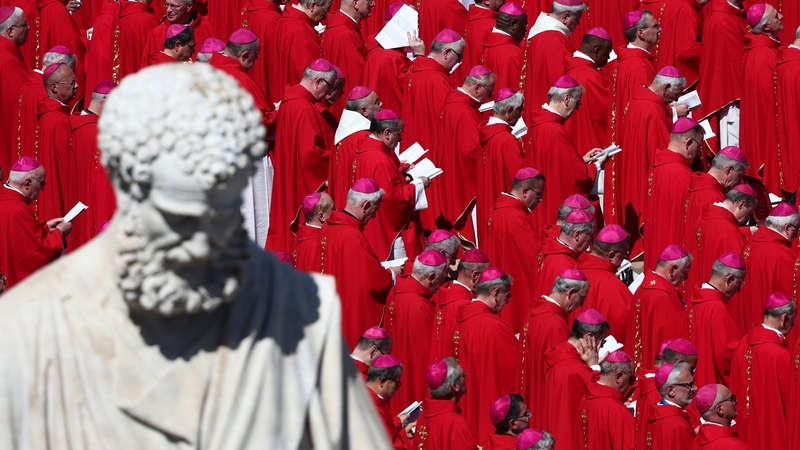 St Peter's statue and cardinals during the funeral ceremony of Pope Francis at St Peter's Square in the Vatican on Saturday