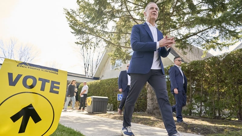 Outgoing Canadian Prime Minister Mark Carney leaves a polling station in Ottawa