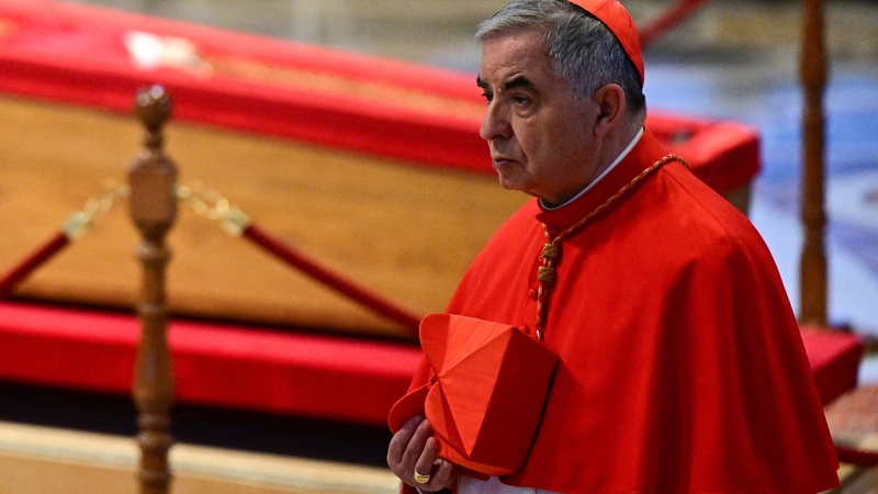 Cardinal Angelo Becciu is pictured as he paid his respects to Pope Francis in St Peter's Basicila last week