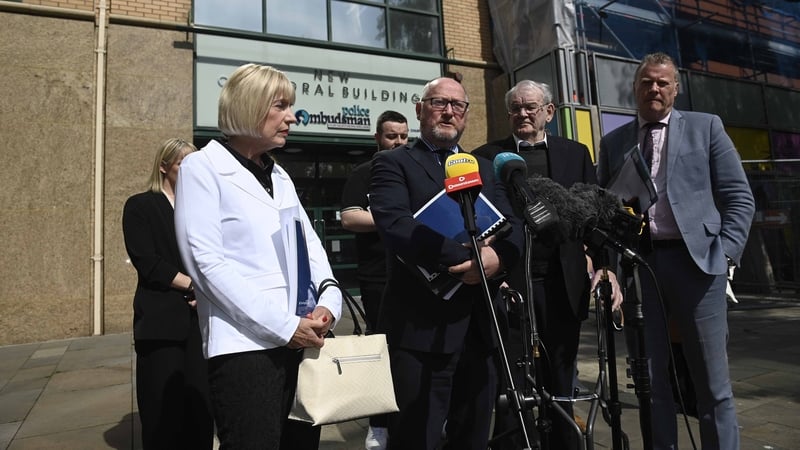Solicitor Barry O'Donnell speaking outside the Ombudsman's office with survivor Alan Black and the families of other victims about the report