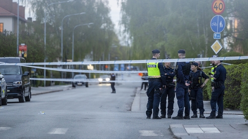 Police cordon off the area around the scene of the shooting in Uppsala