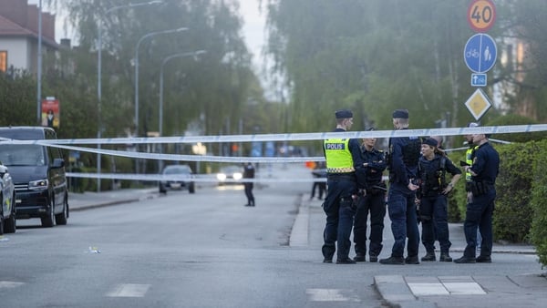 Police cordon off the area around the scene of the shooting in Uppsala
