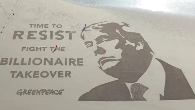 The work marks 100 days of Donald Trump's second term (Pic: Greenpeace)