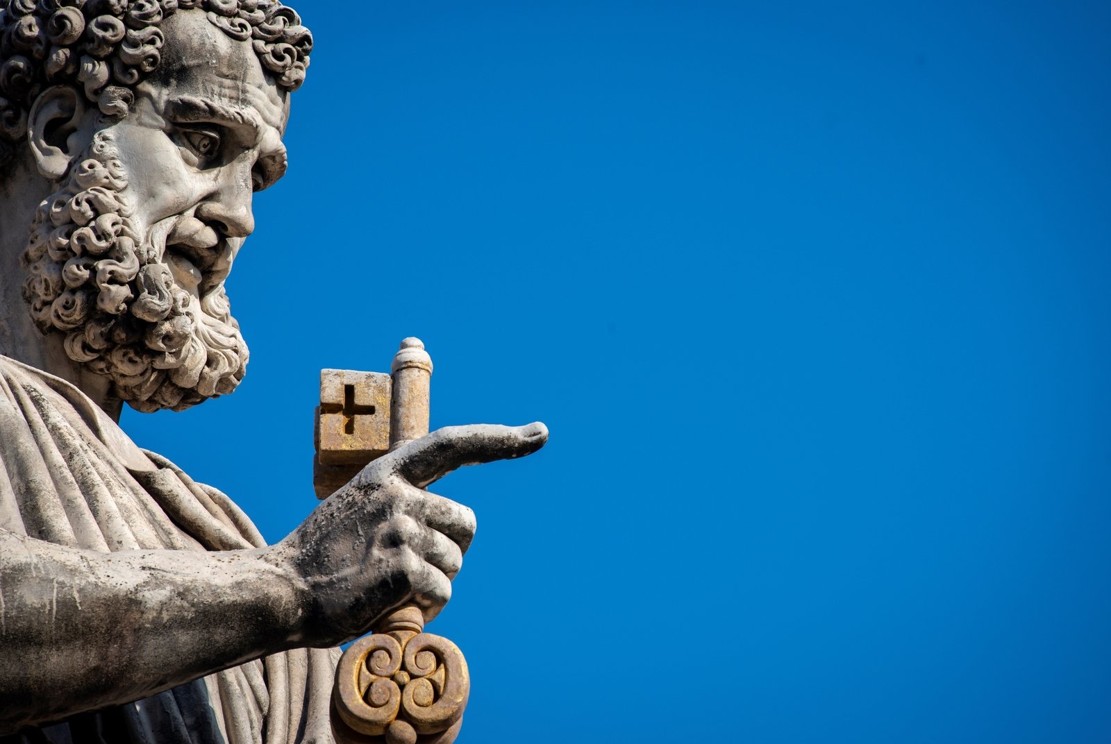 A statue of Saint Peter holding the key of heaven outside St Peter's Basilica