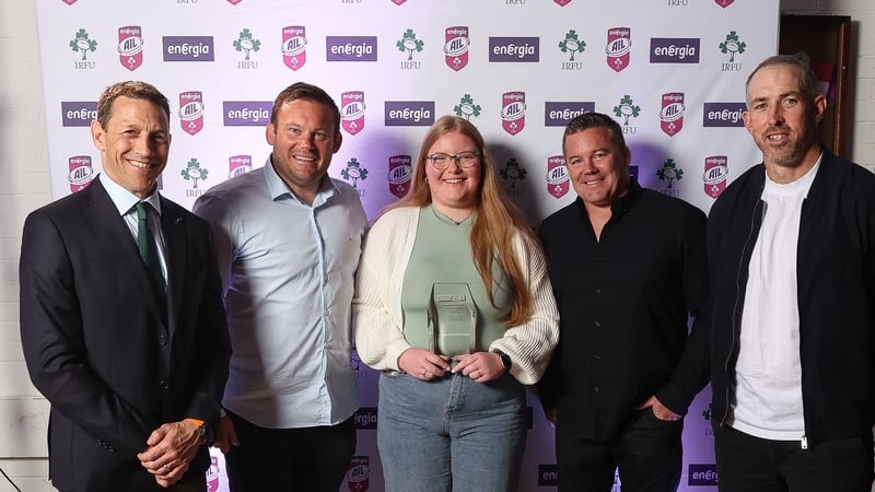 Caoilinn Cahill accepting the Energia All-Ireland League Women's Division Player of the Year award on behalf of her sister Eilís. Pictured with Scott Bemand, Denis Fogarty, John Fogarty and Andrew Goodman