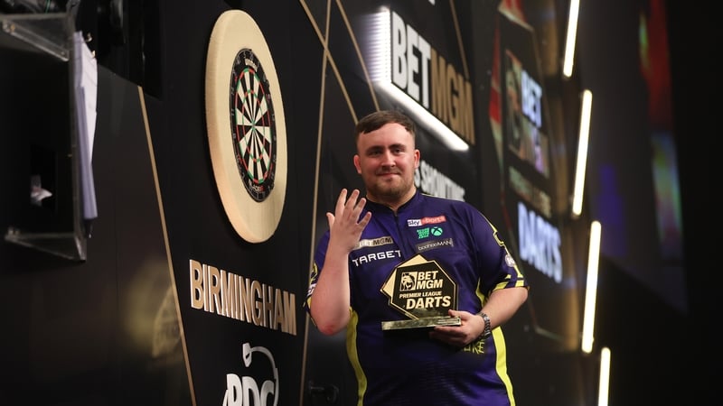 Luke Littler celebrates winning an unprecedented fifth Premier League title of the season