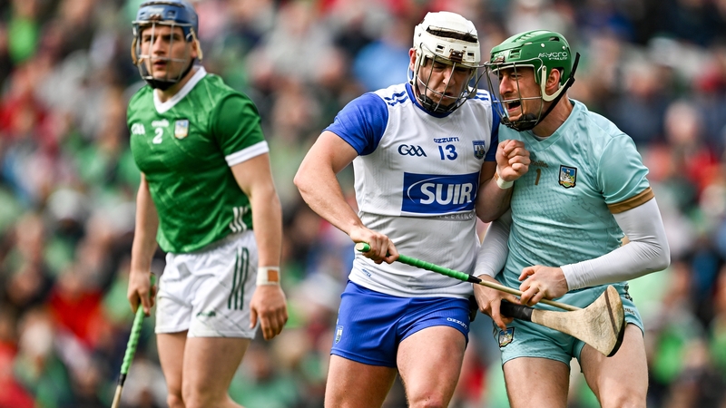 Limerick goalkeeper Nickie Quaid (R) and Dessie Hutchinson (C) of Waterford during last year's Munster meeting
