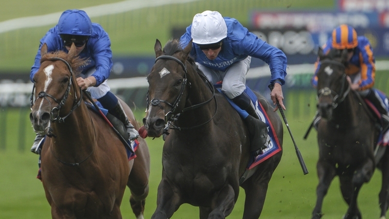 William Buick riding Ruling Court (white cap) wins the 2000 Guineas