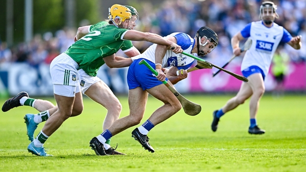 Mark Fitzgerald of Waterford is pursued by Tom Morrissey and William O'Donoghue