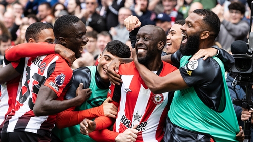 Yoane Wissa is mobbed after scoring Brentford's fourth goal