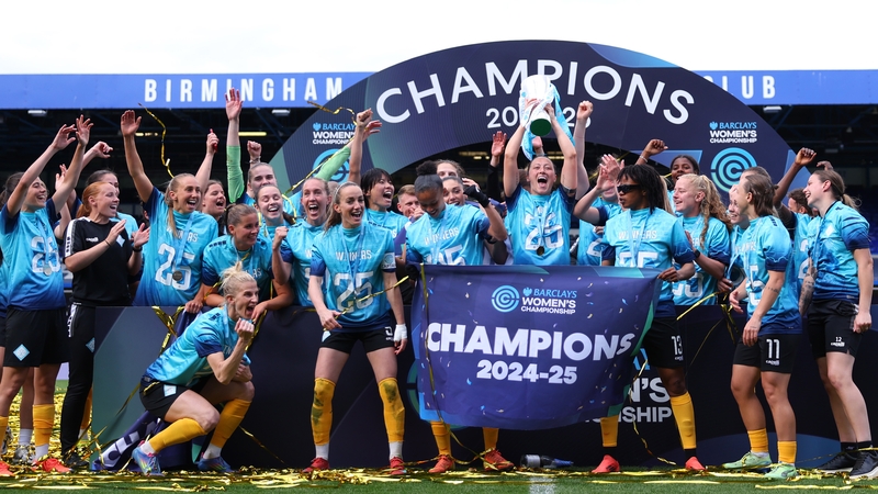 Megan Campbell lifts the trophy as London City Lionesses celebrate their title