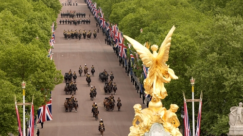 Members of Britain's armed forces march on The Mall during the military procession