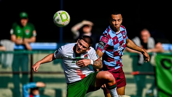 Drogheda's Douglas James-Taylor under pressure from Cork's Sean Murray