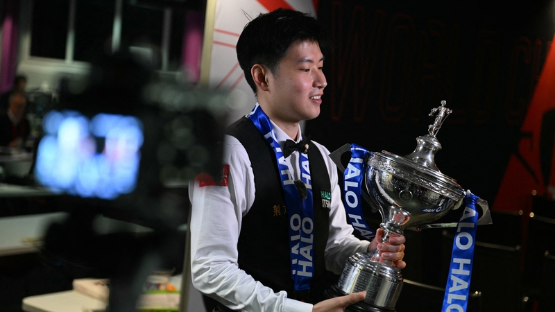 Zhao Xintong was crowned China's first world snooker champion after withstanding a stirring comeback from Williams to complete an 18-12 win at the Crucible