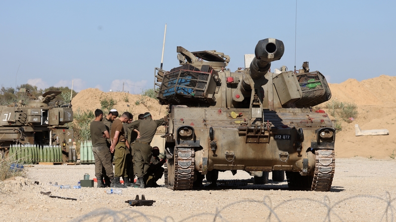 Israeli soldiers are seen close to the border with Gaza