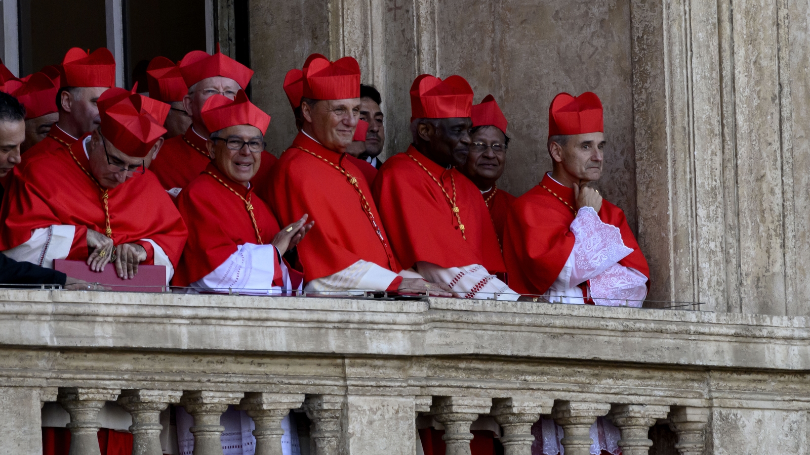 Cardinals - some of whom might have been locked in conclave - gathered to witness the first address from the newly elected Pontiff