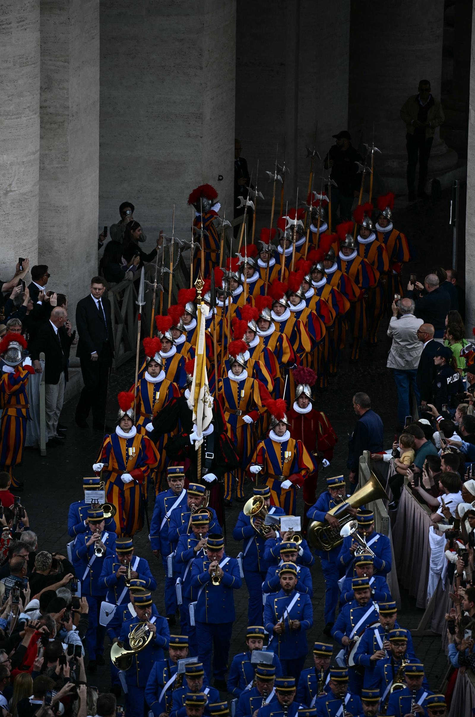 Swiss Guards and a music band entered the parvis of St Peter's Basilica after news of the Pope's election