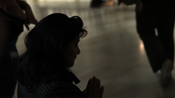 Worshiper prays in a church in New York city