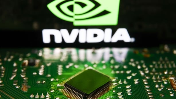 A green Nvidia logo over a chip and motherboard