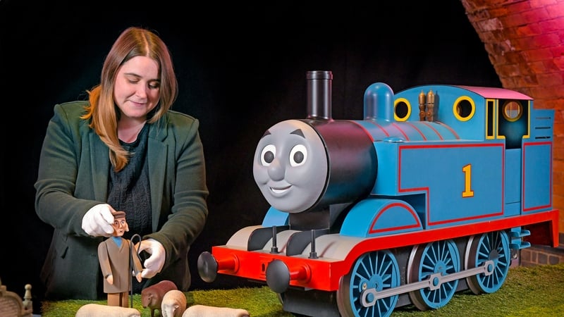 Photo issued by Mattel of Sian Taylor, the Auction Manager at Propstore, showcasing the original props from Thomas & Friends with signed items from celebrities including Olivia Coleman, Eddie Redmayne and Hugh Bonneville. Photo credit: Mattel/PA Wire