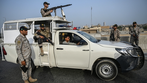 Security personnel stand guard near Karachi Port in Pakistan