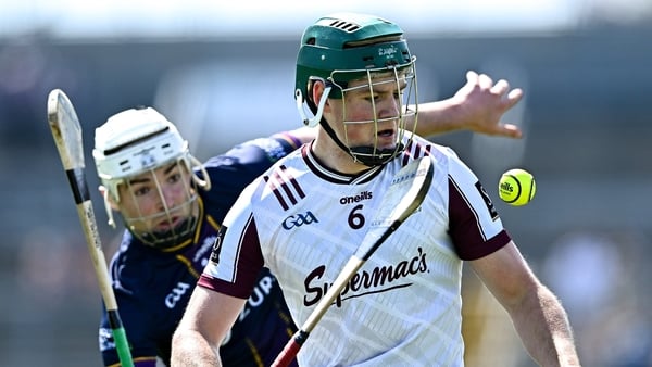 Gavin Lee keeps his eye on the ball despite attentions of Wexford's Rory O'Connor