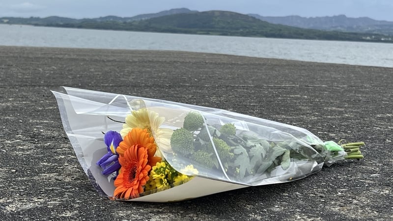Flowers left close to the area where the teenagers died yesterday afternoon
