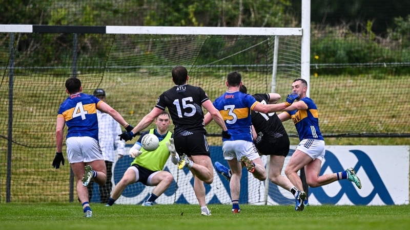 Alan McLoughlin of Sligo, second from right, shoots past Tipperary goalkeeper Shane Ryan to score his side's second goal