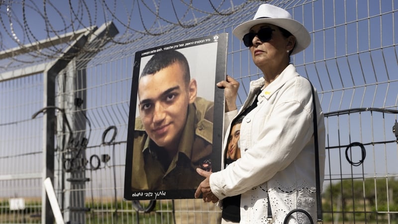 Varda Ben Baruch holds a photo of her grandson Israeli-American hostage Edan Alexander