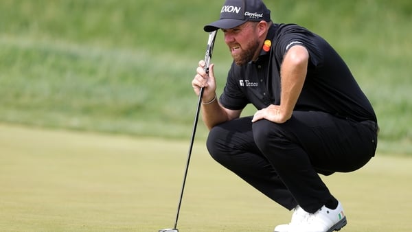 Shane Lowry lining up a putt on the 11th green during the final round