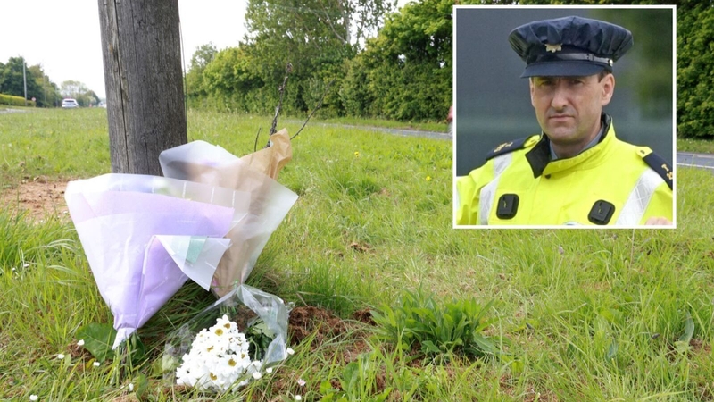 Flowers are pictured at the scene where Garda Kevin Flatley was knocked down and killed in Dublin while carrying out a speeding checkpoint