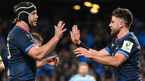 Hugo Keenan (r) says Leinster will be extra motivated to win the URC for injured captain Caelan Doris (l)