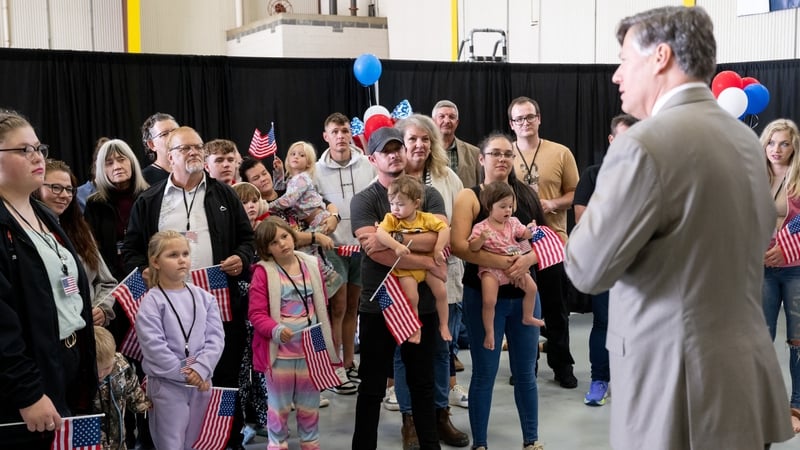 Many of the new arrivals, including young children, were seen at the airport holding small US flags
