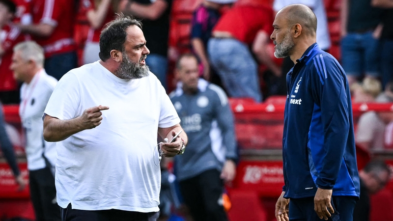 Nottingham Forest's co-owner Evangelos Marinakis (L) confronted manager Nuno Espirito Santo on the pitch after Awoniyi tried to play on despite appearing to be injured