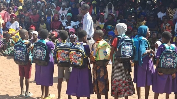 Pupils in Malawi wearing the donated schoolbags