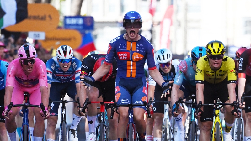 Casper Van Uden (C) celebrates his victory