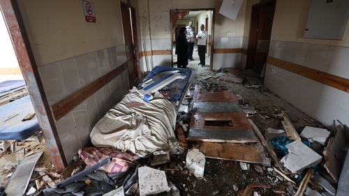 Palestinians inspect the destruction inside the Nasser hospital in Khan Younis in southern Gaza following an Israeli attack