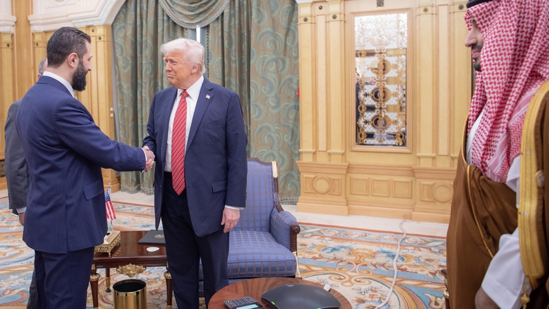 Donald Trump shakes hands with Syrian President Ahmed Al-Sharaa (Credit: Bandar Al-Jaloud/Saudi Royal Court)