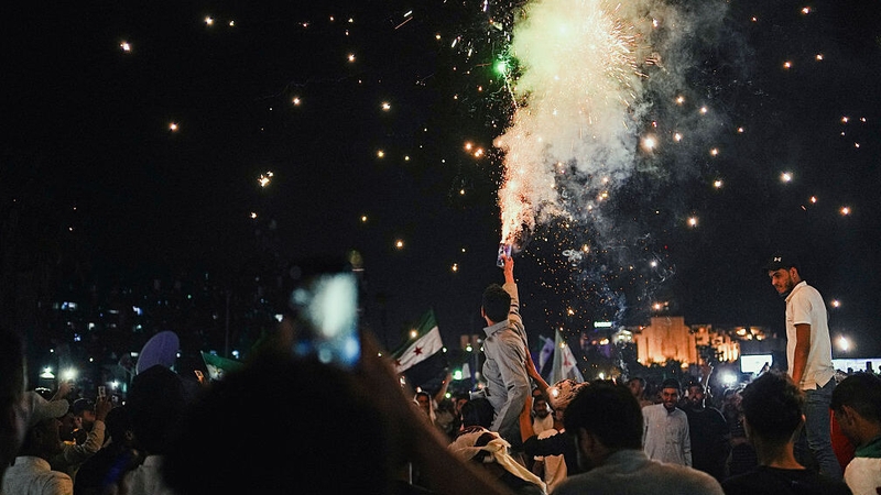 Dozens gathered in the Syrian capital's iconic Umayyad Square, chanting and singing in joy.
