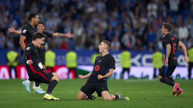 Barcelona players celebrate their league title at the final whistle