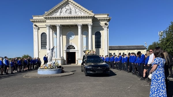 Pupils of Scoil Mhuire Buncrana provided a guard of honour as mourners arrived for the funeral mass of Emmanuel Familola
