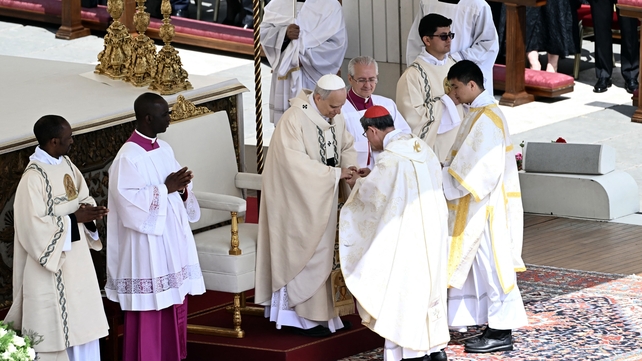 Filipino cardinal Luis Antonio Gokim Tagle puts the Fisherman's Ring on the Pope's finger