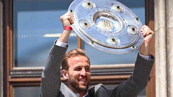 Bayern Munich's Harry Kane celebrates with the Bundesliga trophy