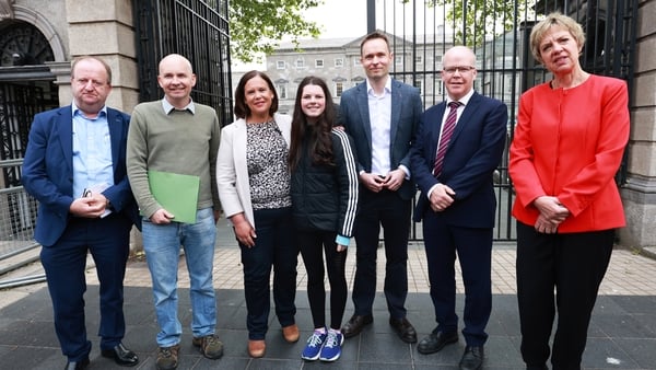Opposition party leaders pictured with Cara Darmody outside the Dáil